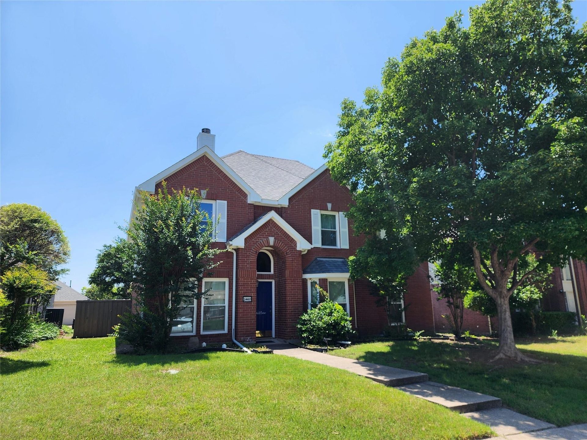 A red-brick two-story home in Plano that Paul Ruth sold