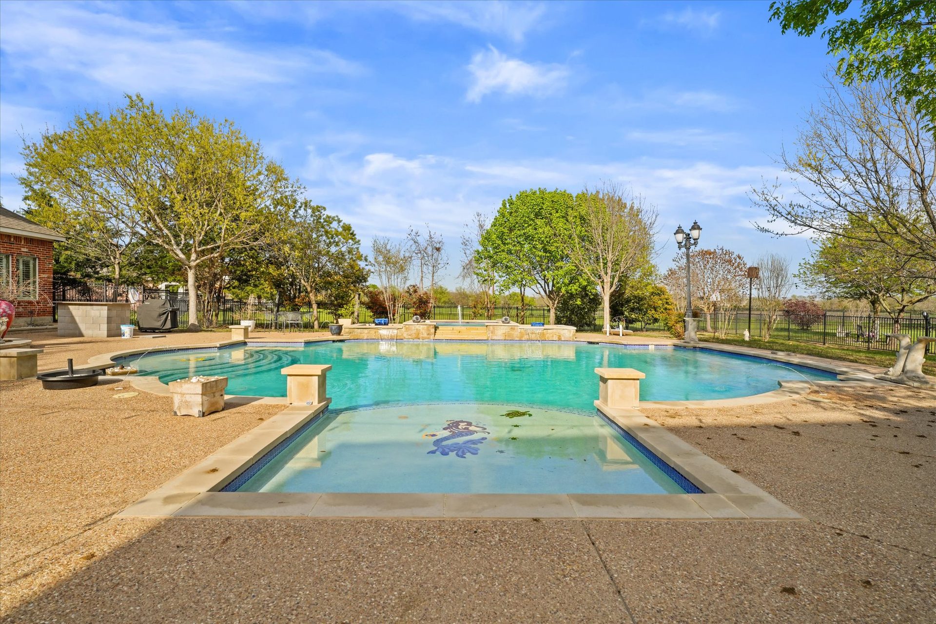 A community pool on a clear day, from one of Paul Ruth's listings